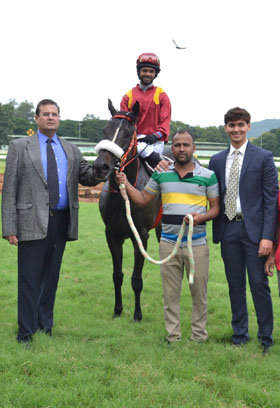 Brightest Star (S Saqlain up) winner of the B.R.HILLS PLATE (DIV-II), being led in by trainer Eshwer M on Wednesday races at Mysore.